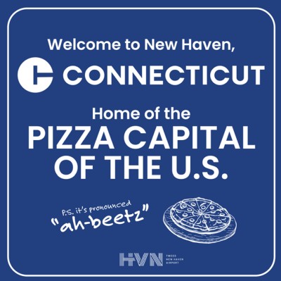 Sign with text that says, "Welcome to New Haven, Connecticut. Home of the pizza capital of the U.S."