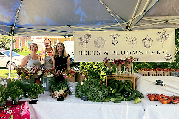 Lieutenant Governor with two constituents from Beets and Blooms Farm.