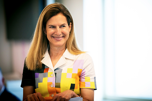 Lieutenant Governor Susan Bysiewicz smiling while holding documents.
