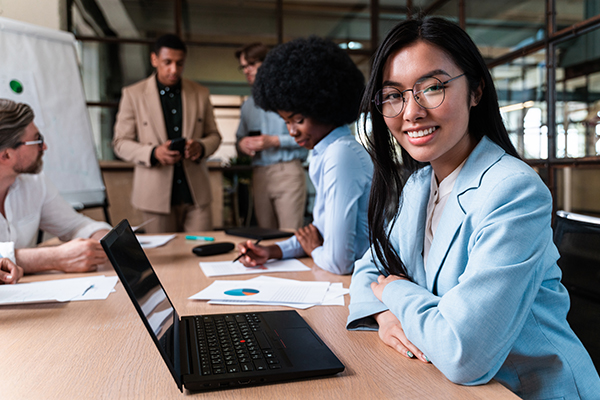 Five Interns working in an office environment.