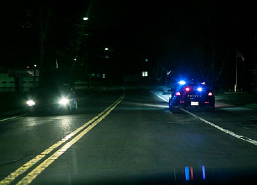 a police car stopped in the shoulder - mover over law - traffic safety