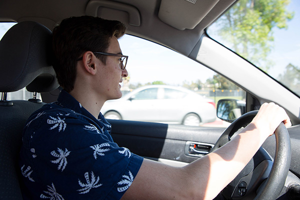 teen boy driving a car