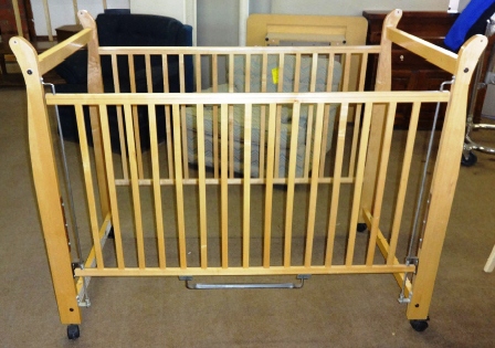 Crib with hot sale sliding side