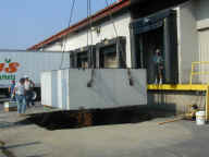 food scraps collection container being
lowered into place at the Foodshare facility