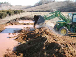 photograph of bulking agent being mixed with food waste slurry