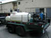 trailer with a water tank and pressure hose