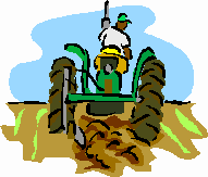 man on a green tractor plowing a field