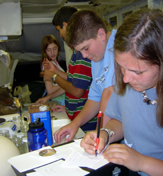 Students experimenting in the DEP's mobile laboratory.