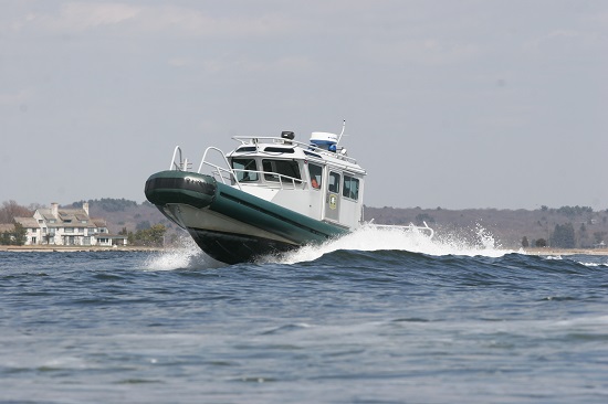 Boat crashing through the waves