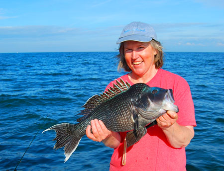 Alison Varina with her 5 pound 4 oounce 23.5 inches state record balck sea bass