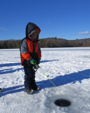 Boy ice fishing