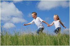 kids playing outdoors in a field