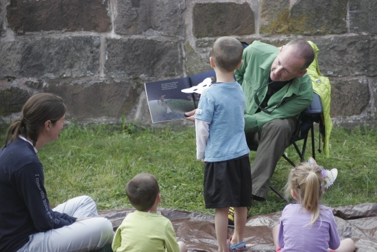 Set against the backdrop of the Old New-Gate Prison, some young fans listen to bat tales as part of Bat Appreciation Day-a celebration of wildlife and history.