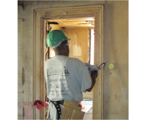 Man Deconstructing Door Framing