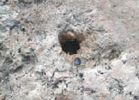 Photograph of a small pothole