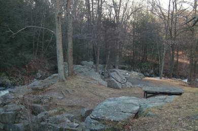Photograph of ridge of rocks along the brook.