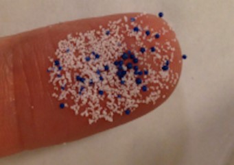 Microbeads on finger