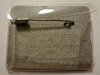 1945 plastic hunting license holder with cardboard insert
