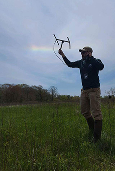 Field technician using radio telemetry equipment 