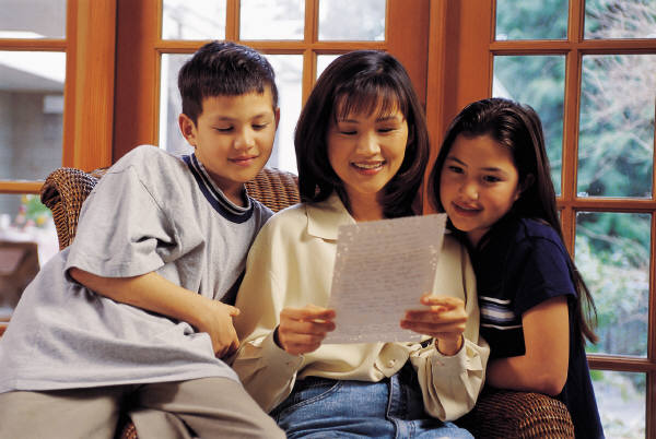 Mother reading to children