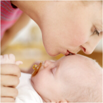 Mother Kissing Baby