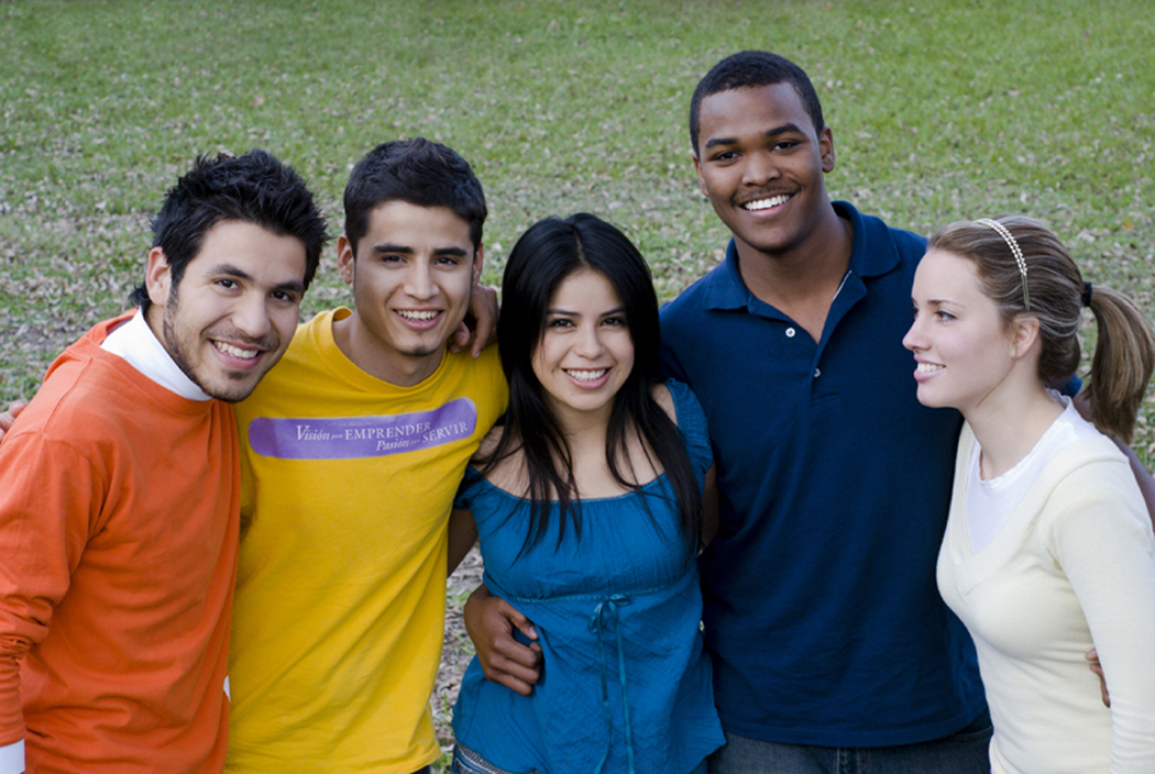 group of young people with arms around shoulders