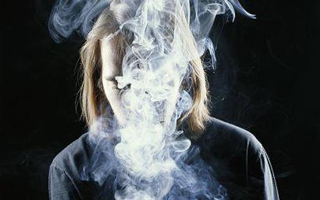 women covered in smoke