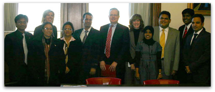 Colleen Murphy (fifth from the right) with Representative Kim Fawcett (third from the left), columnist Kevin Rennie (center), and government officials and reporters from the countries of Nepal and Sri Lanka at the State Capitol. Attendees participated in a discussion on Open Government Information on November 4, 2011.