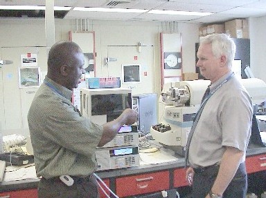 Photo of Bob Howard, Quality Assurance Section chief at the State Public Health Laboratory, reviewing quality control data for the newborn screening program.