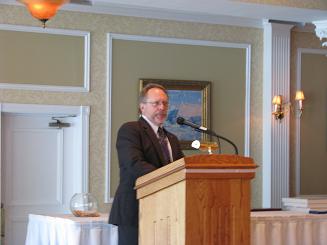 Dr. Martin Anderson, Commissioner of DAS, begins presentations of DMSAs to recipients.