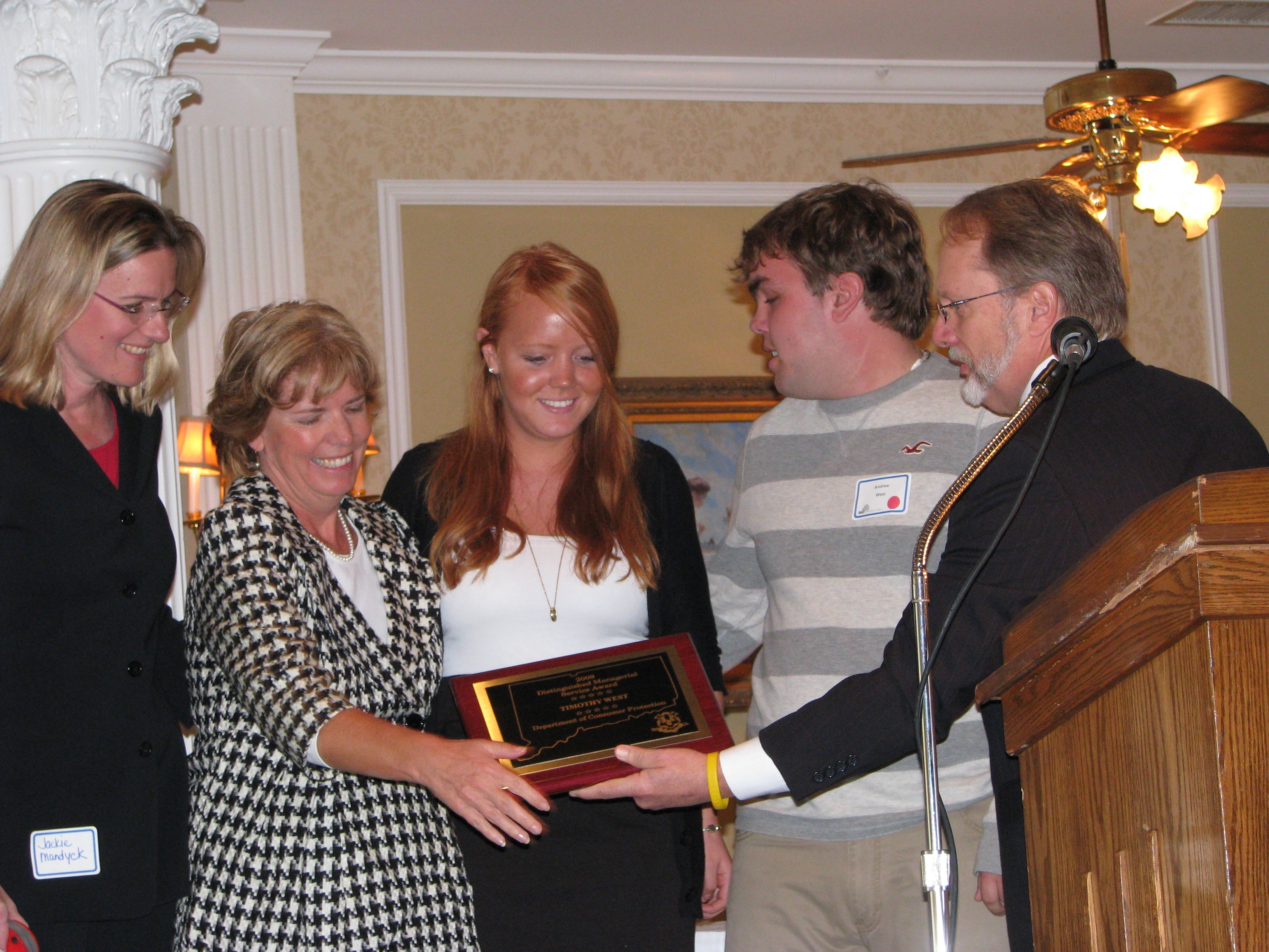 Dr. Anderson congratulates the family of Timothy West.