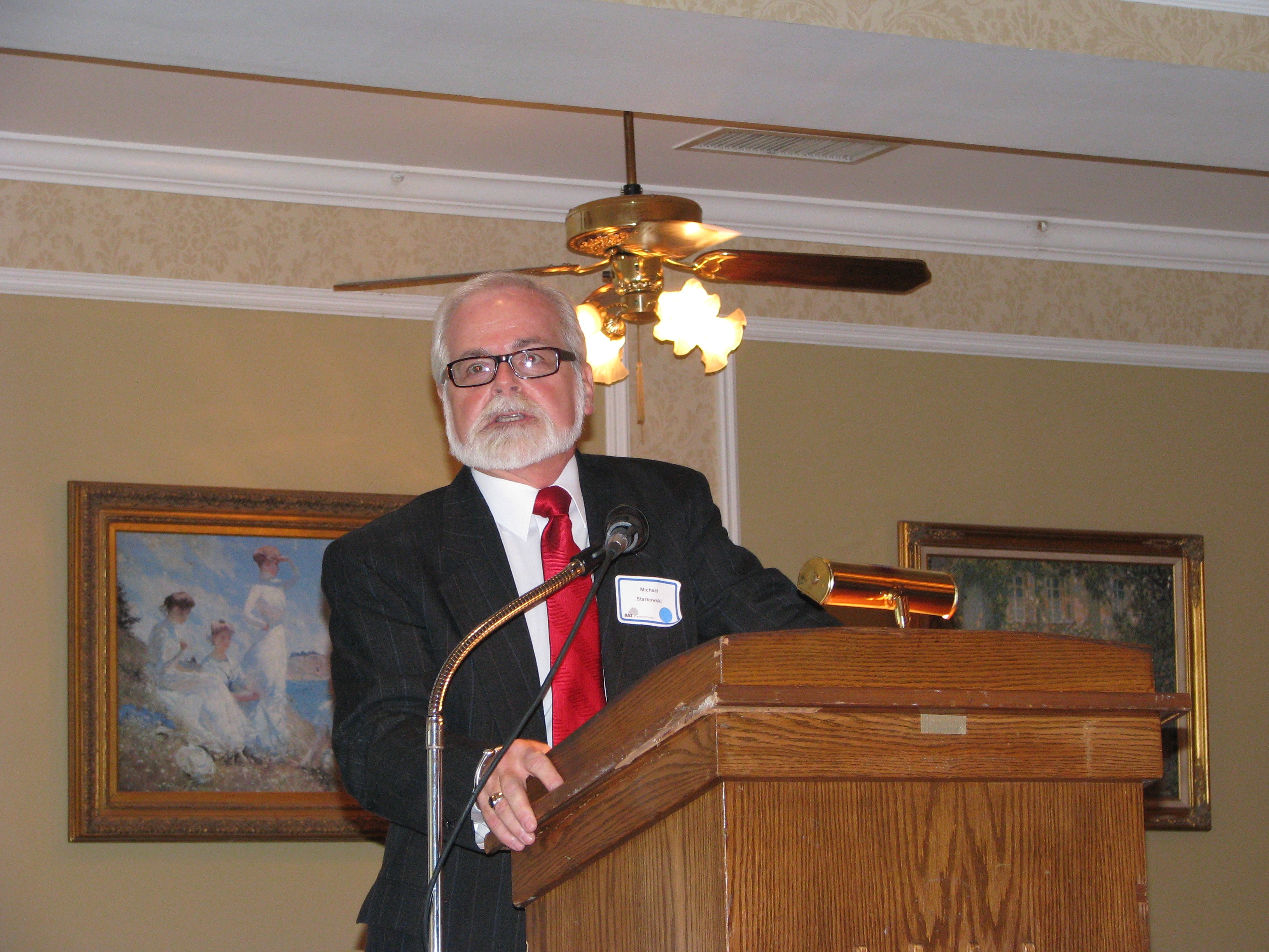 DSS Commissioner Michael Starkowski says some words about DMS award recipient Jim Wietrak.