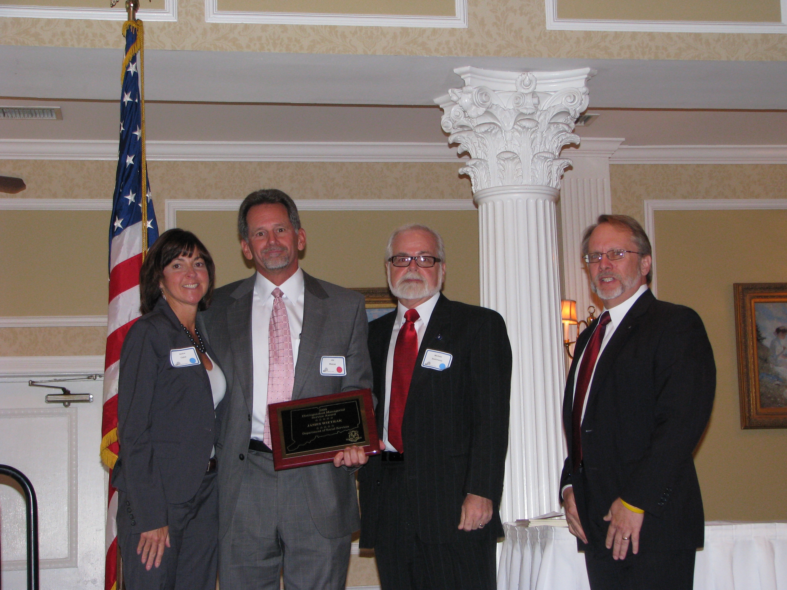 Jim Wietrak and his wife with Commissioner Starkowski and Dr. Anderson.