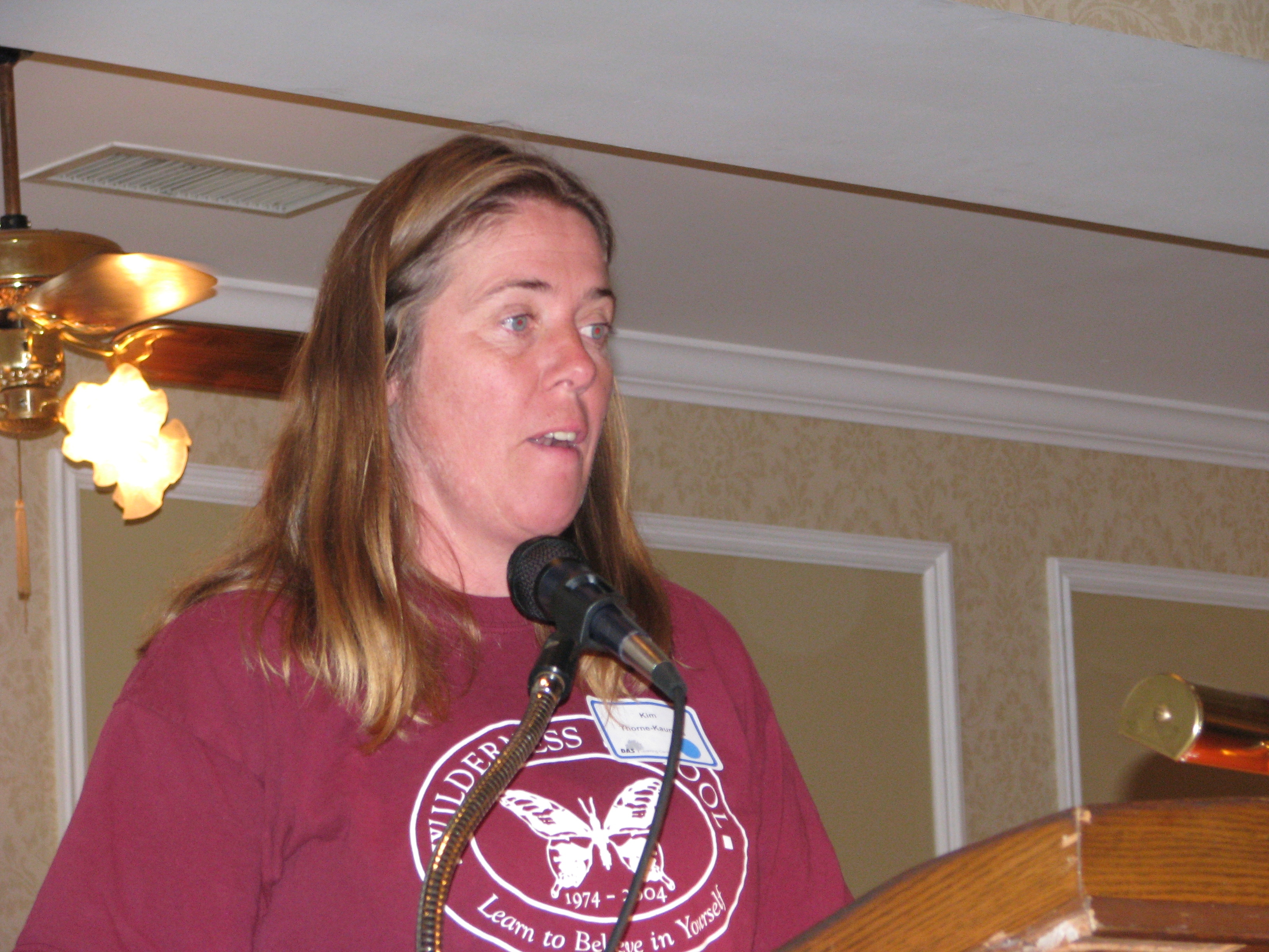 A staff member of the Wilderness School addresses the crowd prior to an interactive group activity.