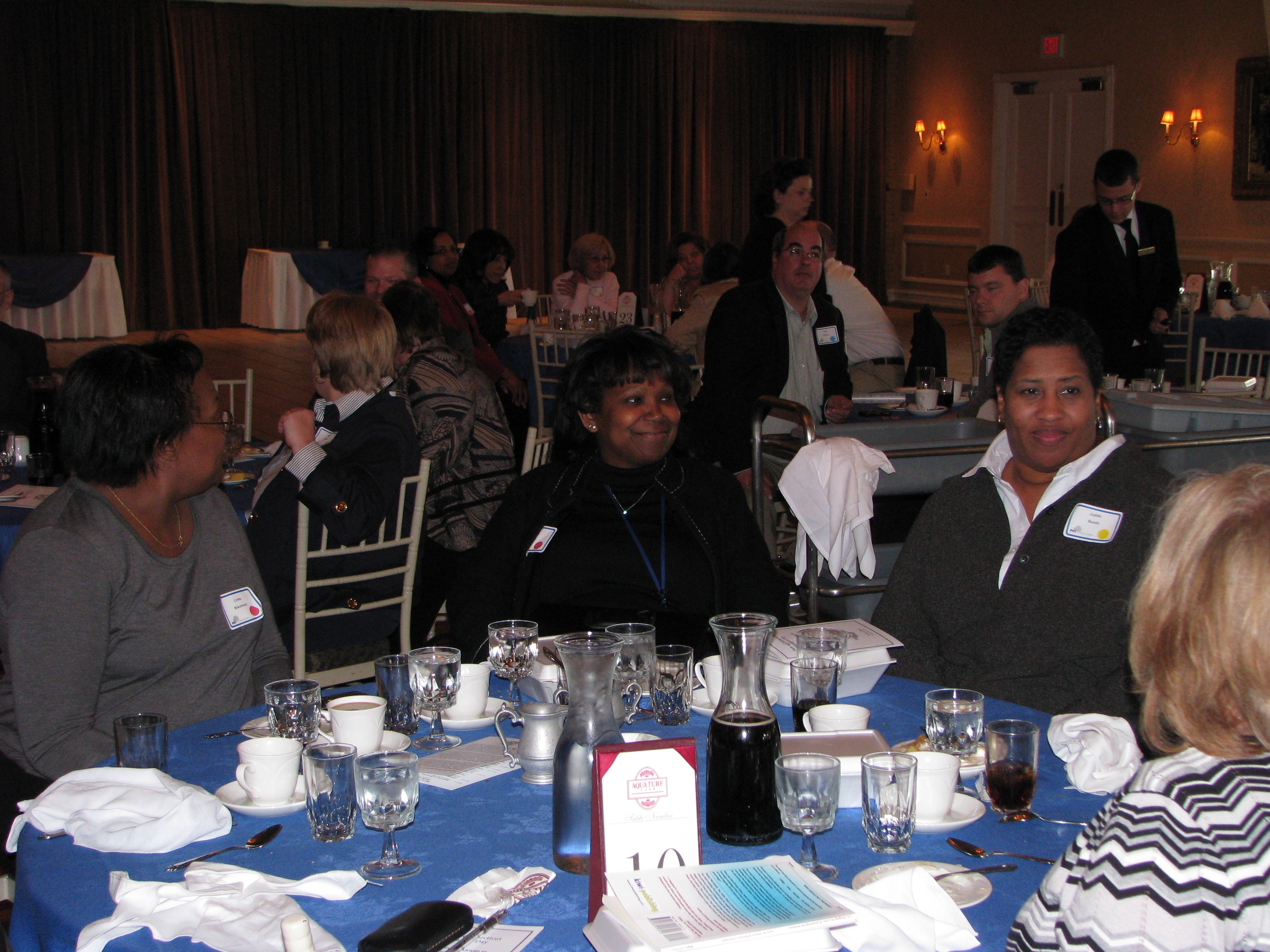 Managers enjoy continental breakfast prior to the start of the festivities.
