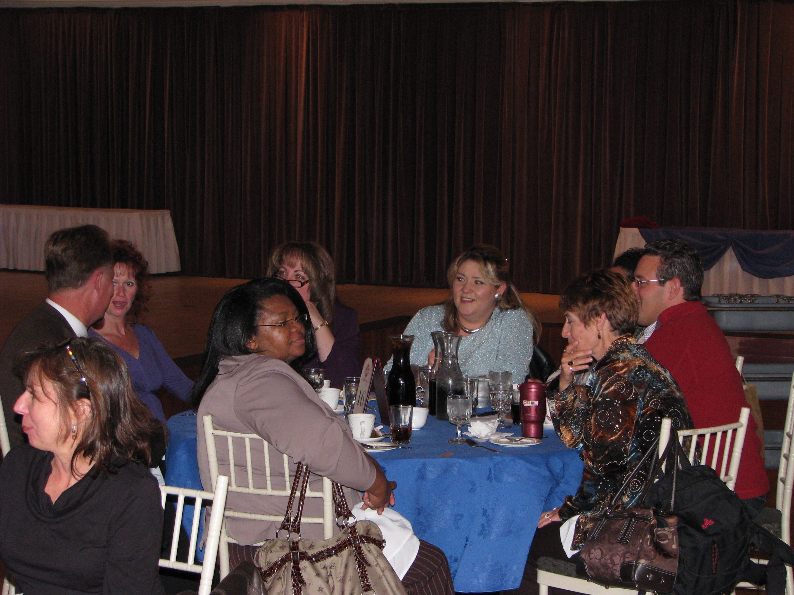 Managers enjoy continental breakfast prior to the start of the festivities.