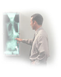 Picture of Doctor examing xrays.