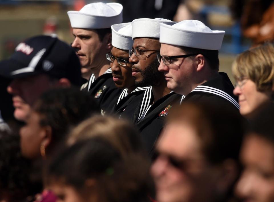 Audience members listen to one of the speakers during a ceremony celebrating the birthday of the US Navy Submarine Force