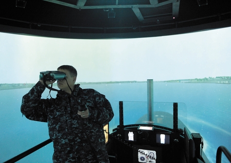 U.S. Navy Lt. Pyle checks the marine traffic atop the bridge simulator