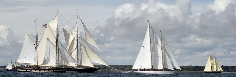 The schooners, from left, Mary E., Mystic Whaler, Columbia,  Brilliant and When and If race away fron the starting line .