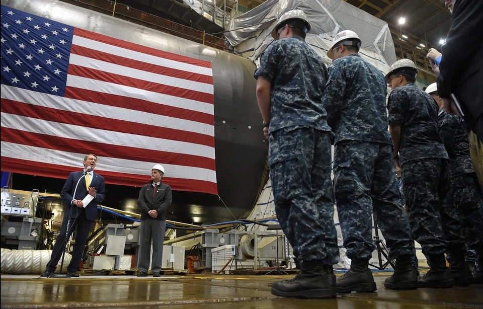 Secretary of Defense Ashton Carter stands in front of the future Virginia-class Colorado