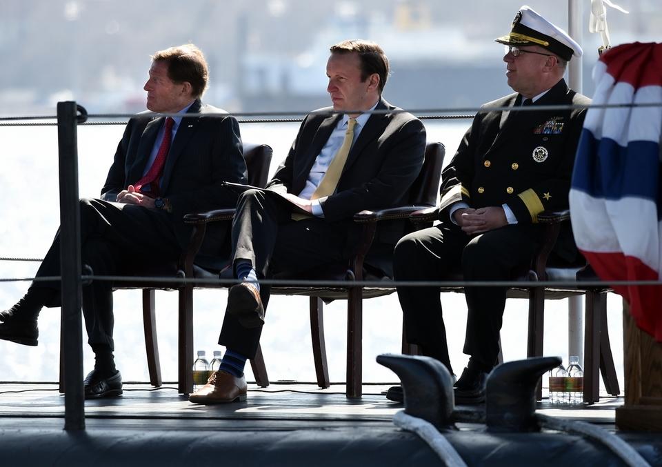 Sens Blumenthal and Murphy and Rear Adm Pitts listen to one of the speakers 