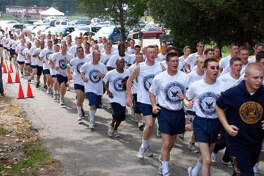 400 Submarine School students and staff run in formation in Naval Submarine Base.