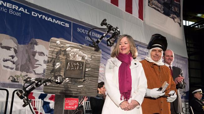 USS South Dakota Sponsor Deanie Dempsey authenticates the keel of the nuclear submarine.