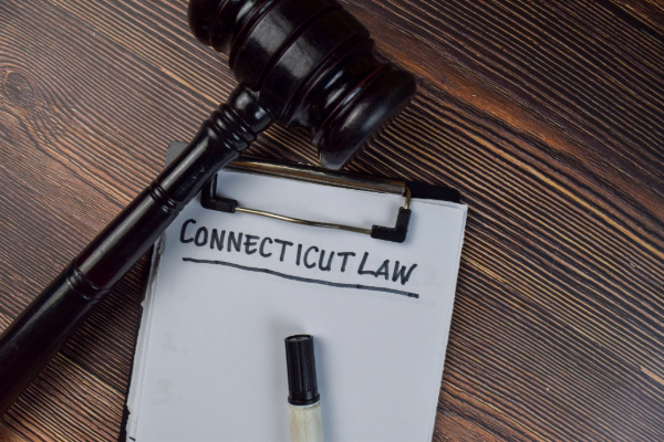 Gavel resting on page that says Connecticut Law