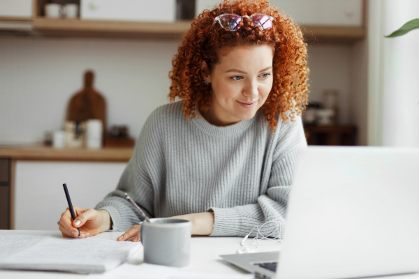 Woman sitting at computer screen