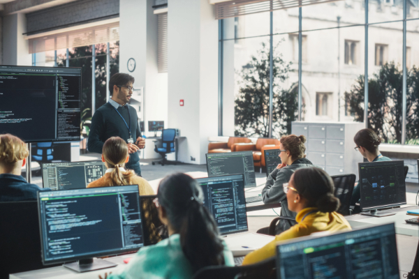 Teacher giving a computer science class
