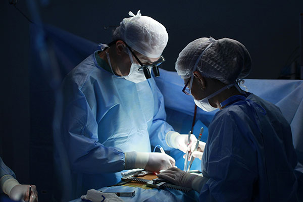 doctors performing surgery