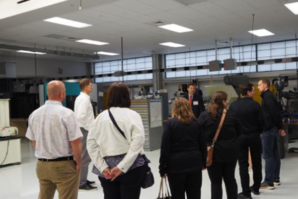 Group of people listening to success stories and impact of Good Jobs Challenge participants