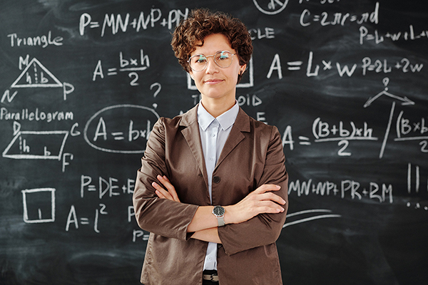 female teacher in front of chalkboard